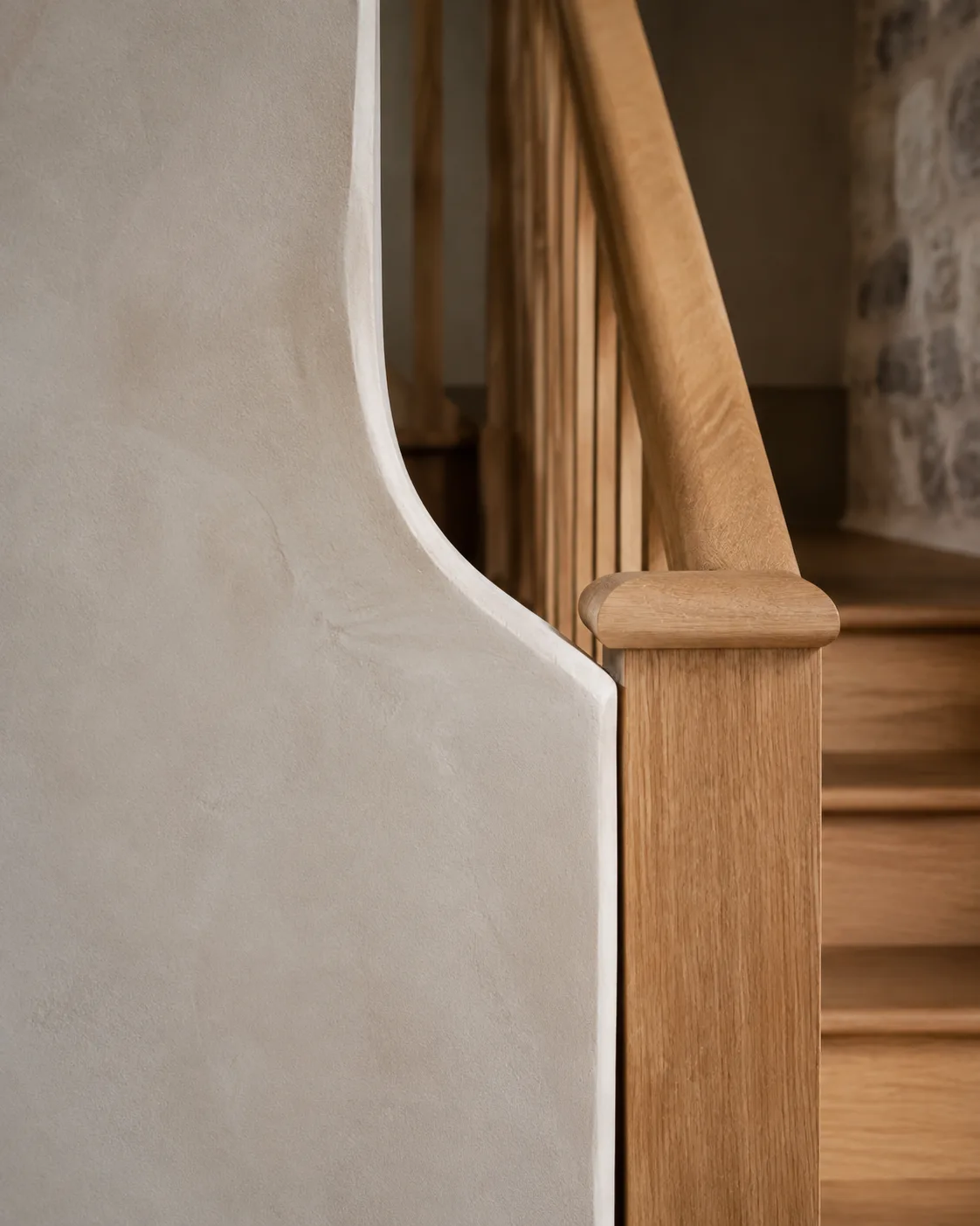 Illustrative lime plaster and solid oak stair balustrade detail