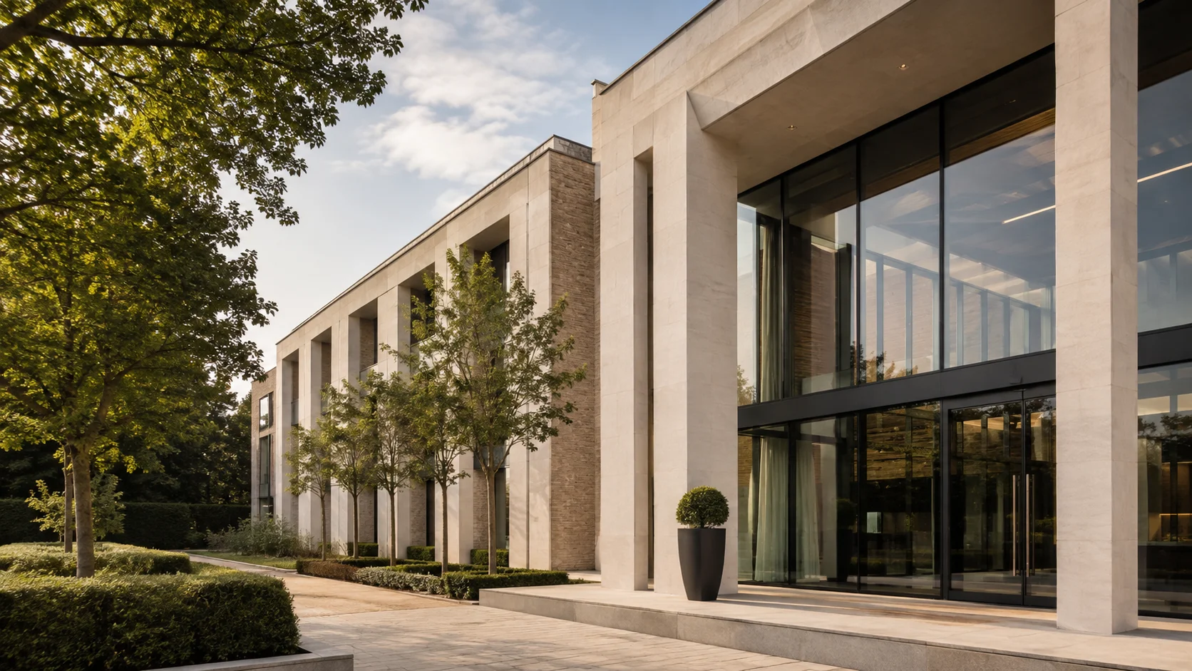 Illustrative limestone building in landscaped grounds